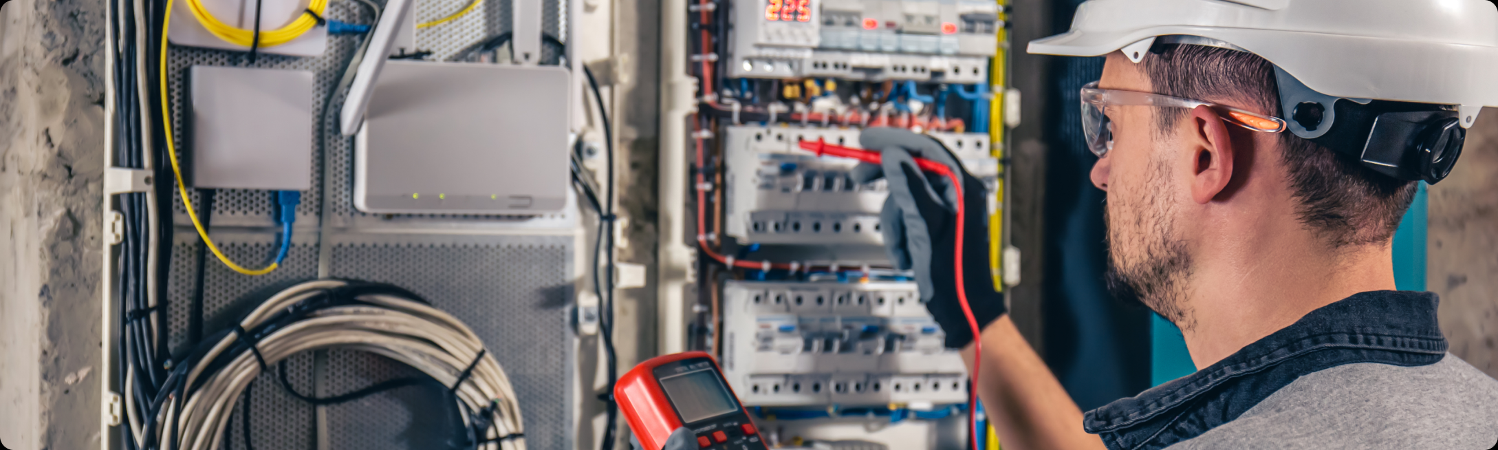 Electrical technician in front a panel